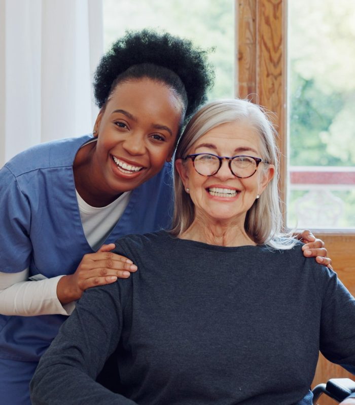 Senior care, caregiver and old woman with wheelchair, portrait and smile in health at nursing home.